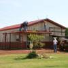 24'x48' SHOP (#5 of 6) with gable overhangs, guttering, wainscote, and porch (June - 2009)