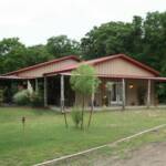 Returned in 2007 to remove overhead doors, extend porch overhang and concrete to match existing porches and overhangs.